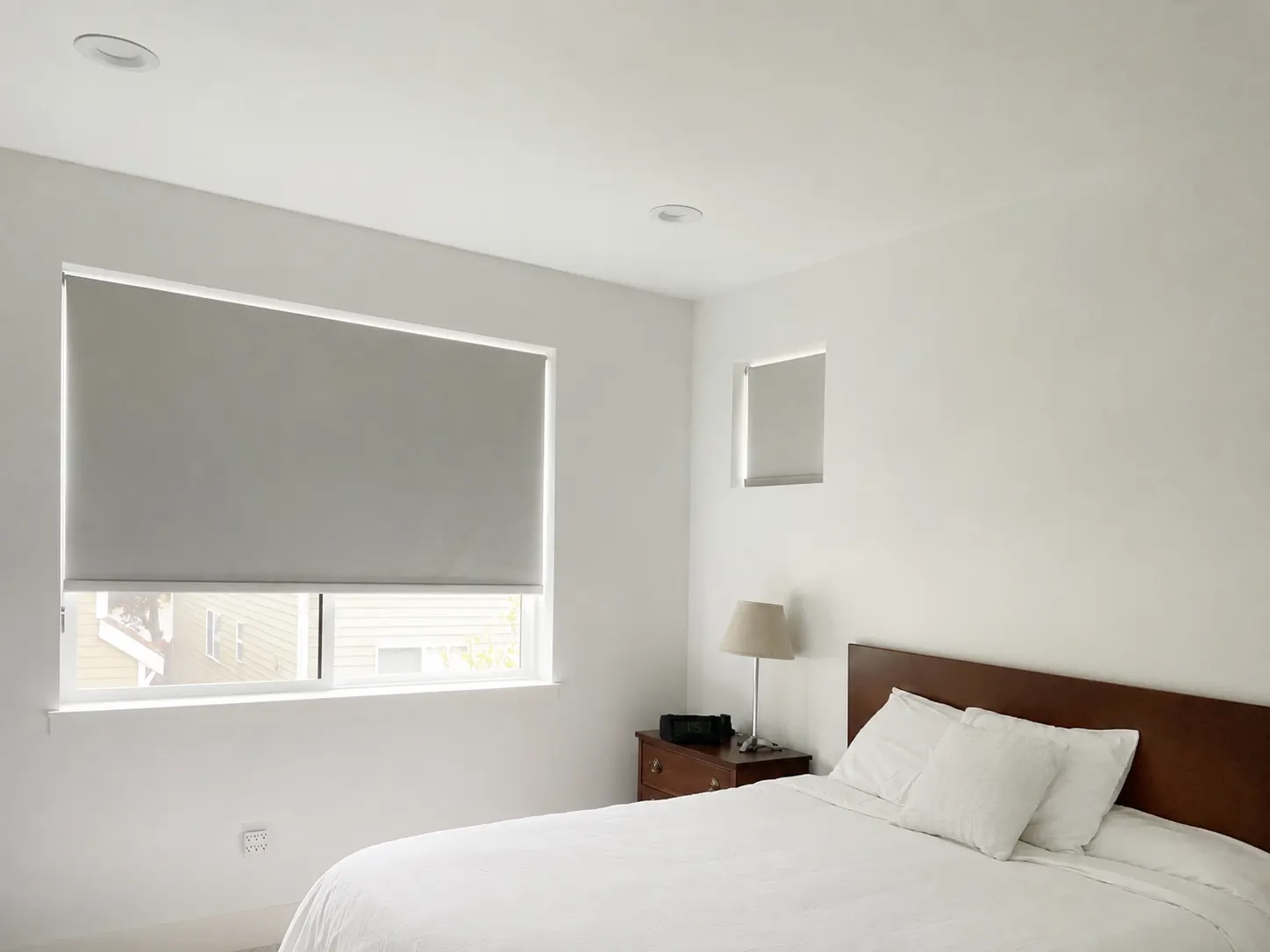 Blackout roller shades installed on bedroom windows in a Renton, WA, home