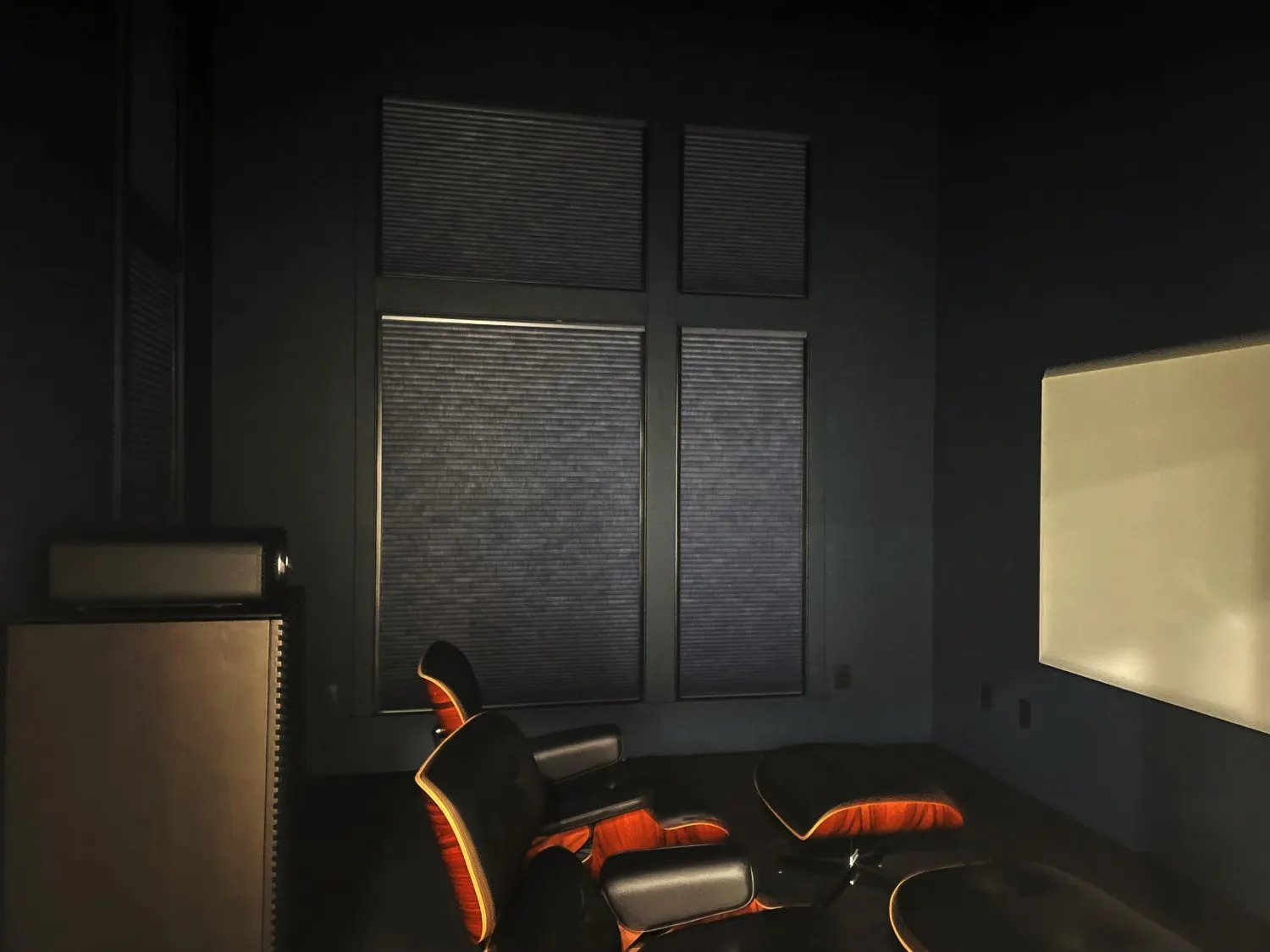 Motorized honeycomb shades with lightlock for a media room in Issaquah, WA