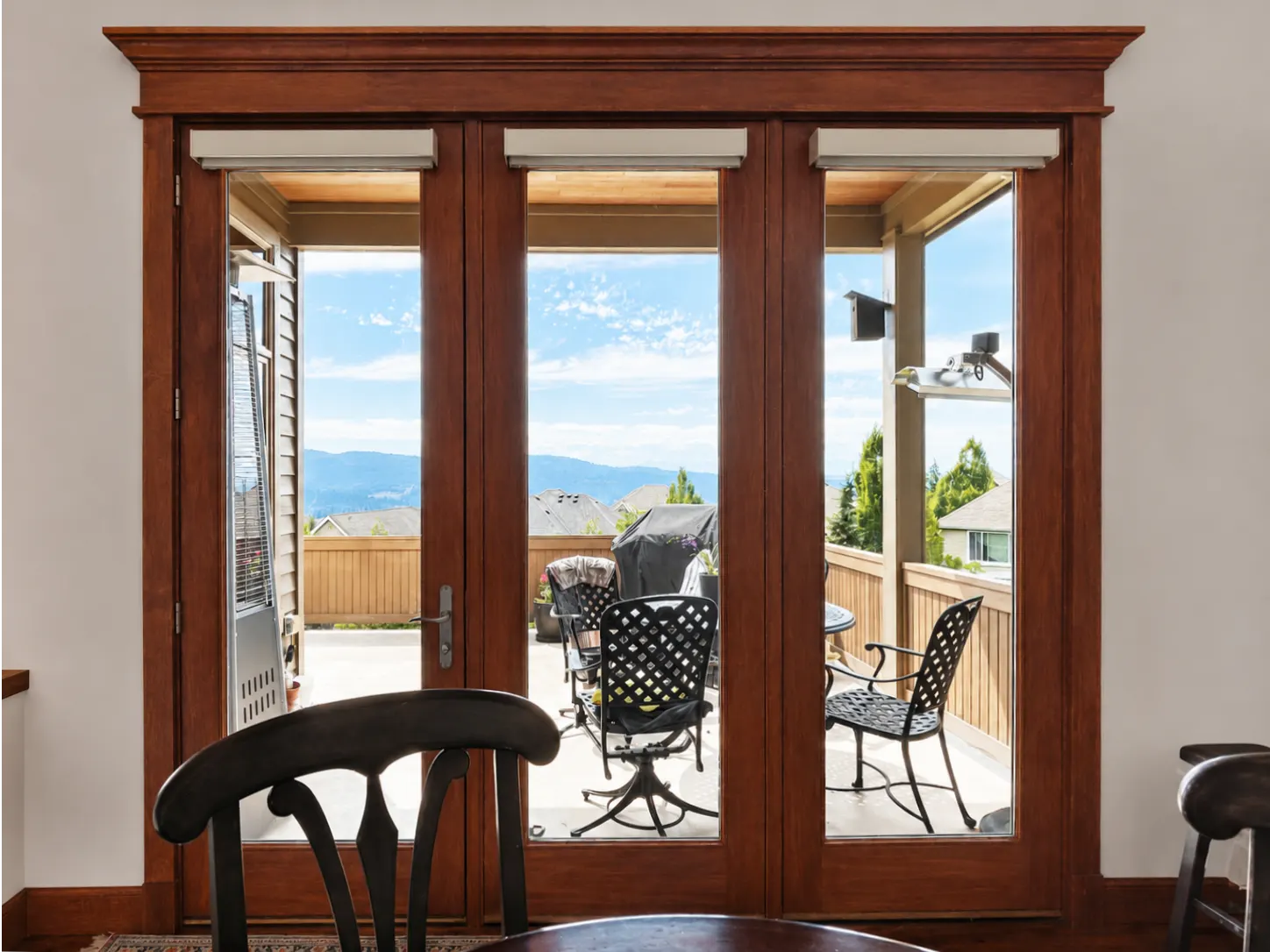 Motorized roller shades on a glass door with fixed glass panels in Issaquah, WA
