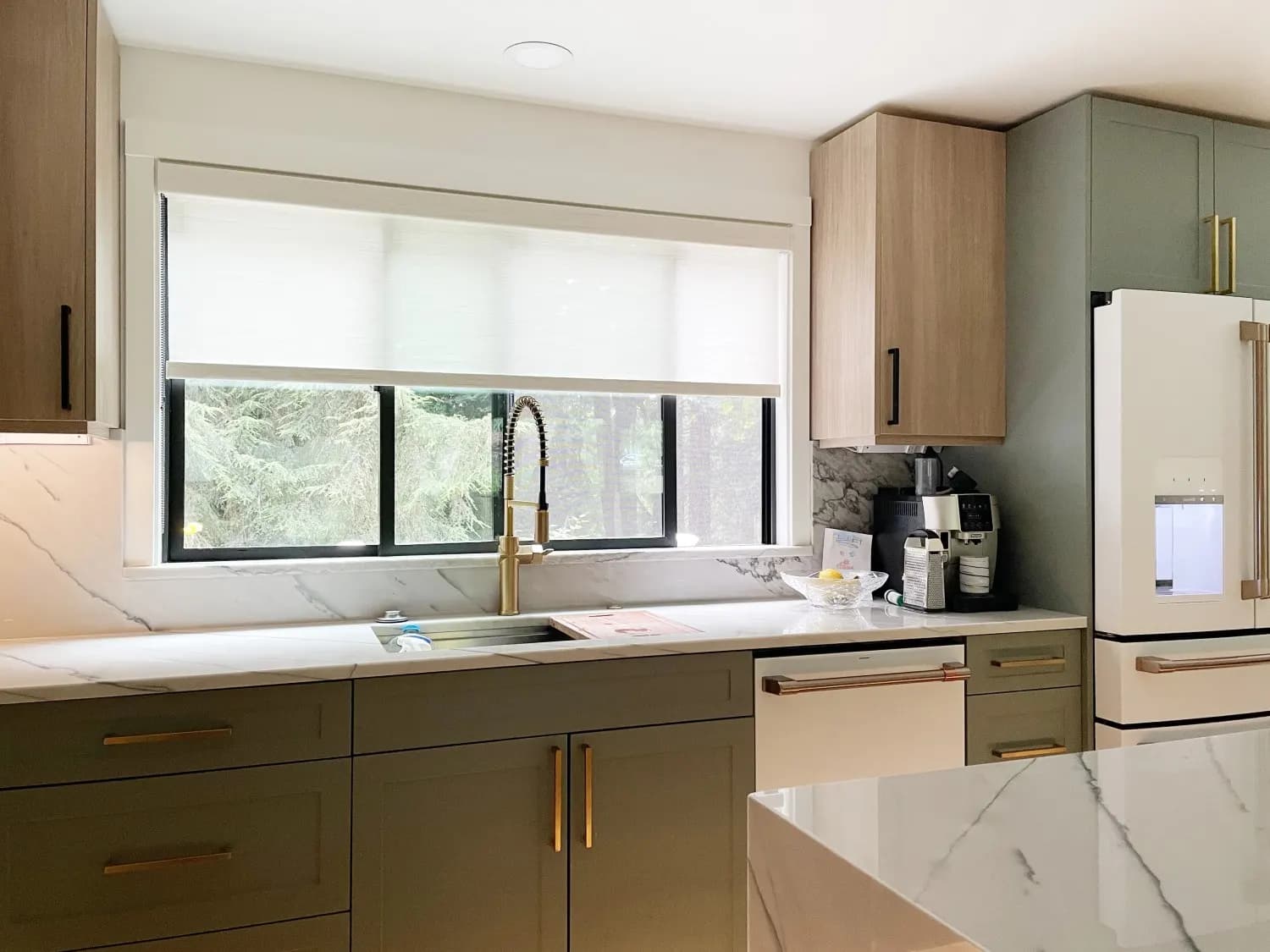 Hunter Douglas roller shades on kitchen window in Woodinville, WA
