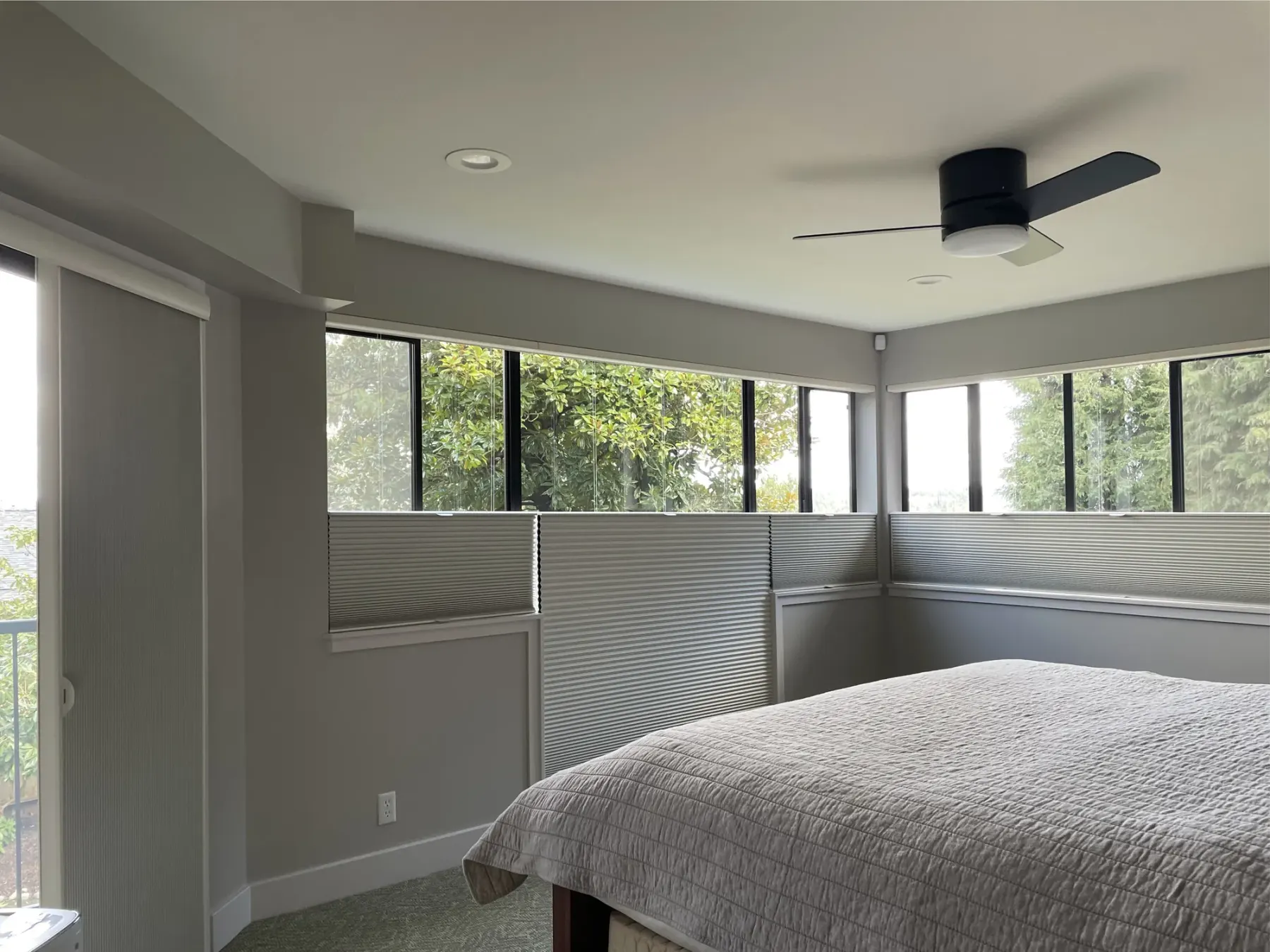 Blackout honeycomb shades on odd-shaped windows in a Seattle bedroom