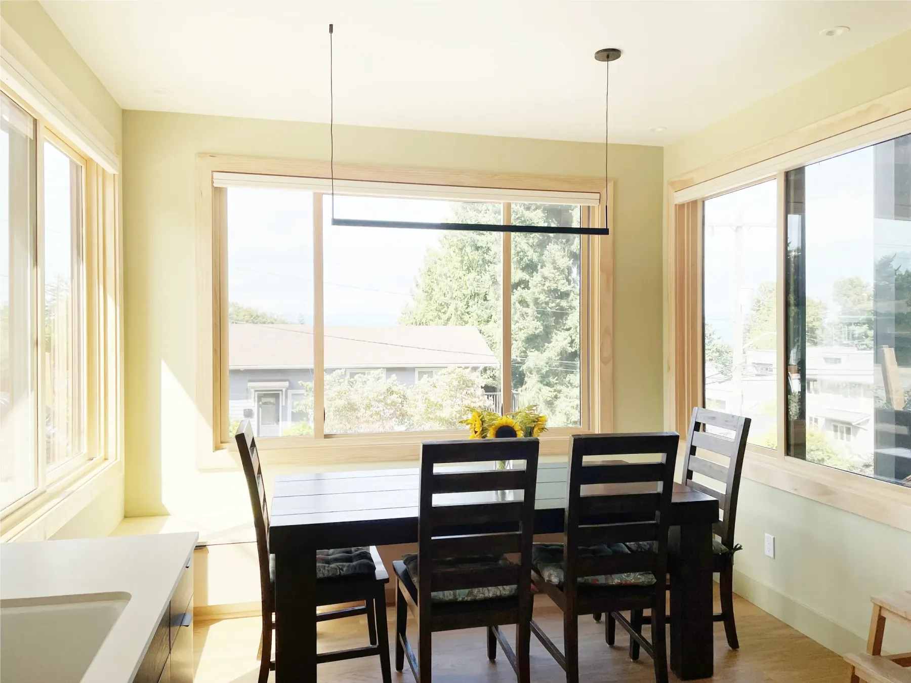 Sunlight and glare coming through dining room windows in a West Seattle home