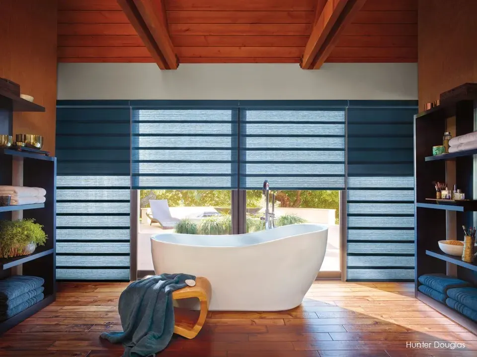 Motorized Vignette Duolite Roman shade with sheer and room darkening fabrics in a bathroom