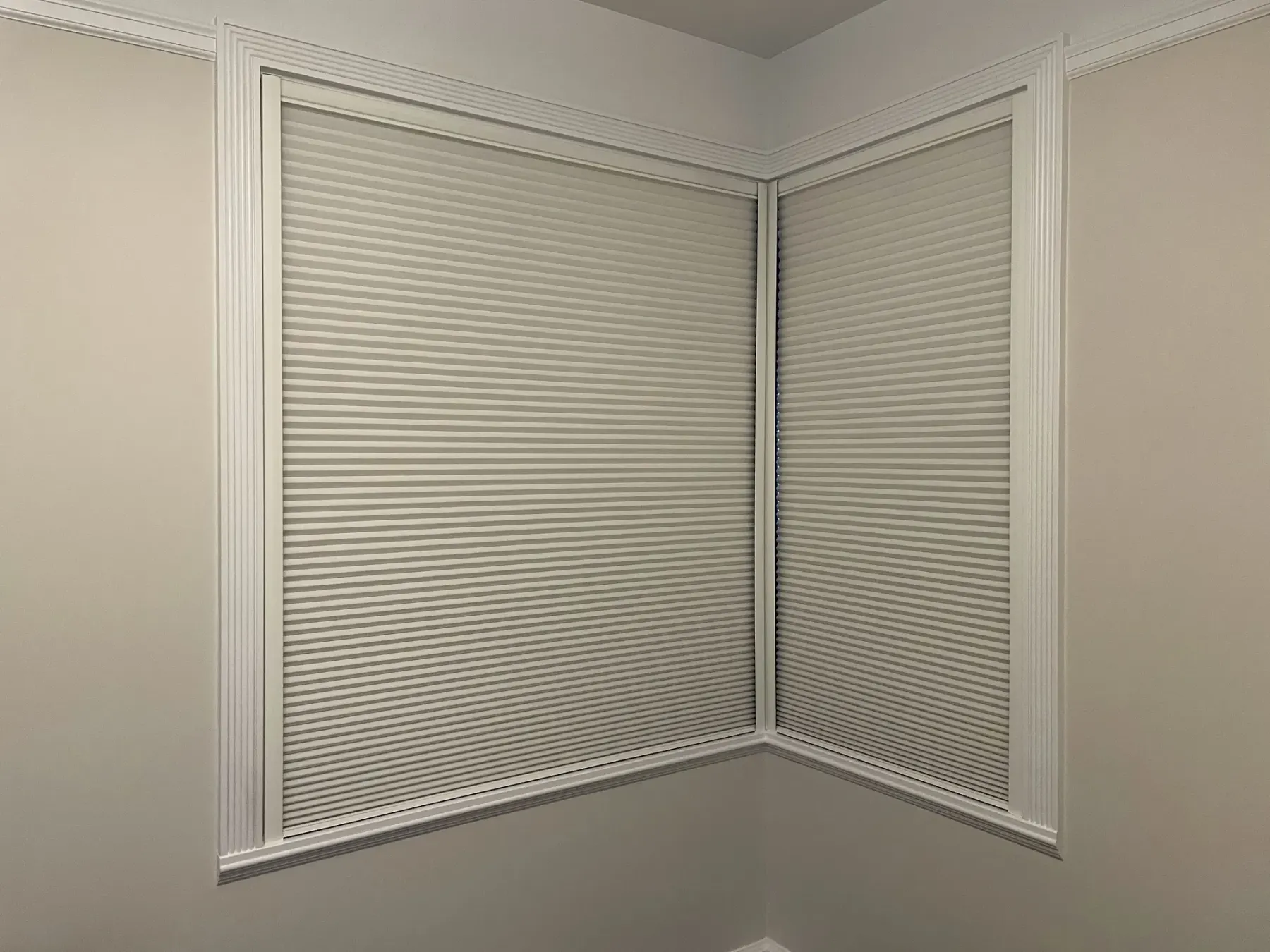 Motorized Duette® Architella® blackout honeycomb shade with LightLock™ in a Seattle bedroom.