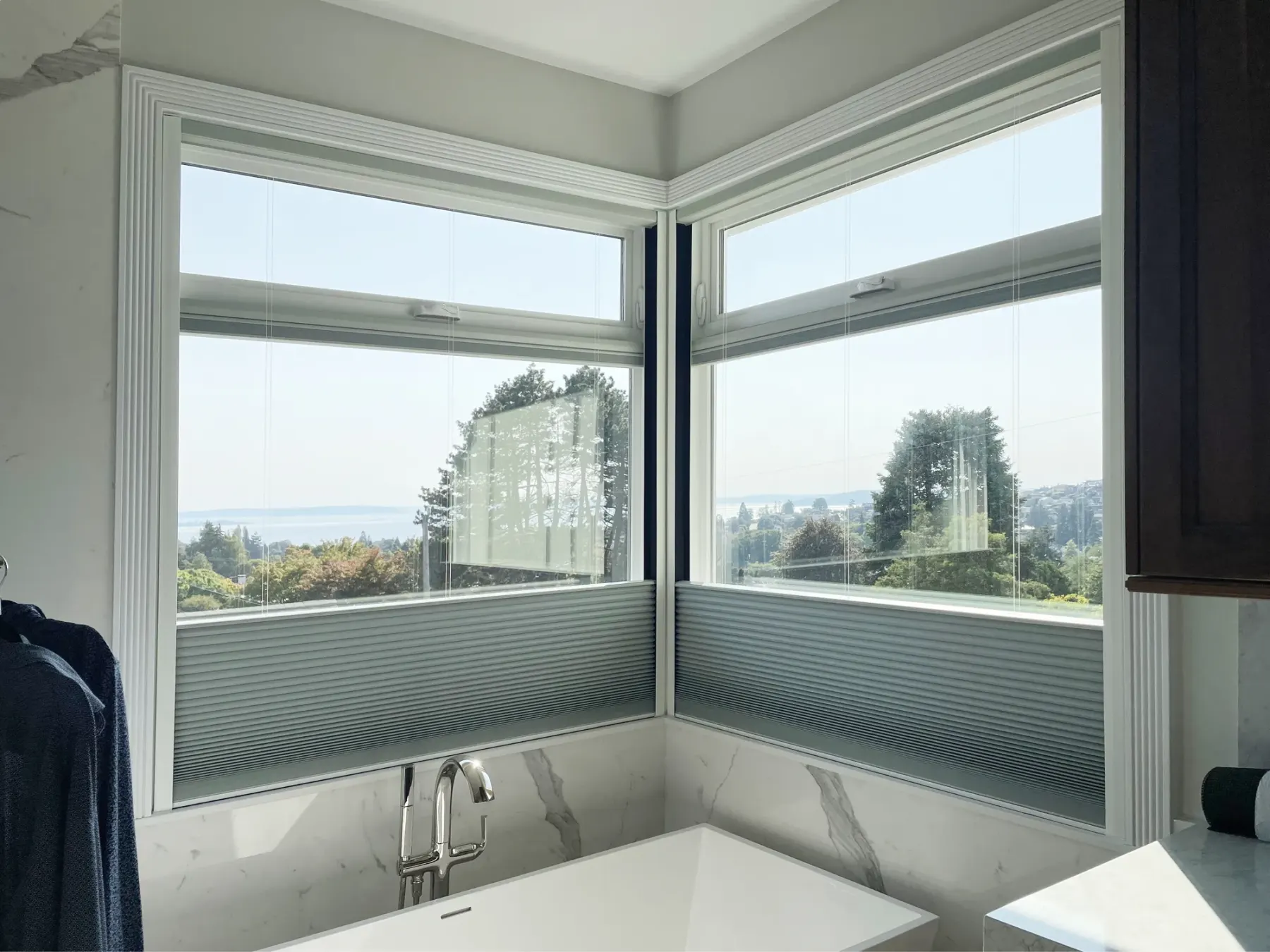 Motorized top-down/bottom-up blackout honeycomb shade installed in a Seattle bathroom.