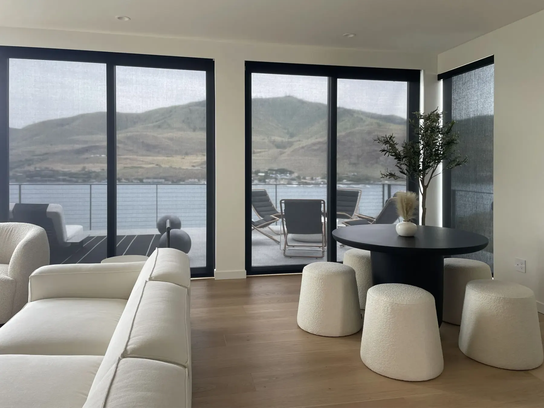 Motorized solar shades installed in sliding glass doors