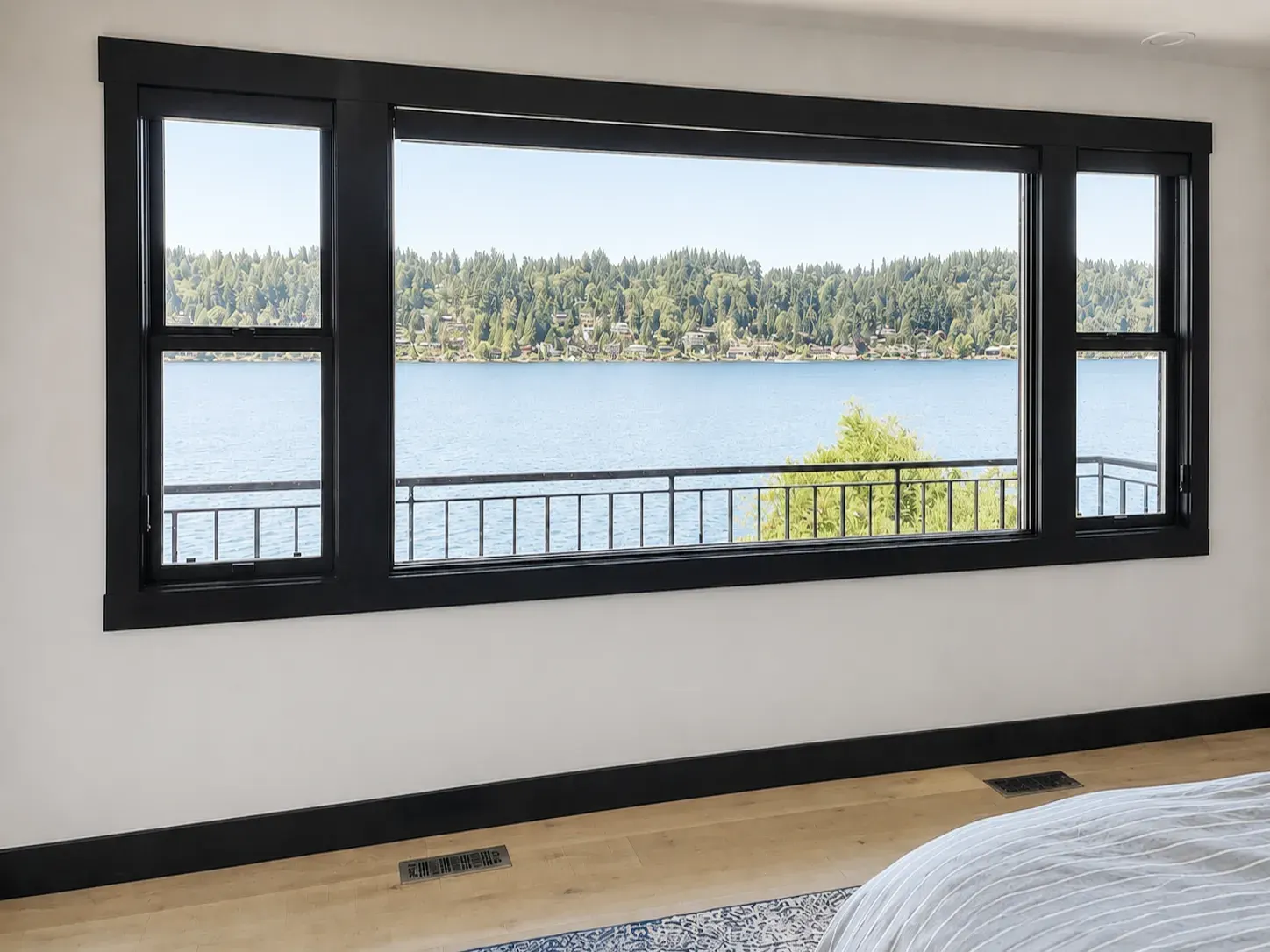 Primary bedroom windows with a waterfront view in Bellevue, WA