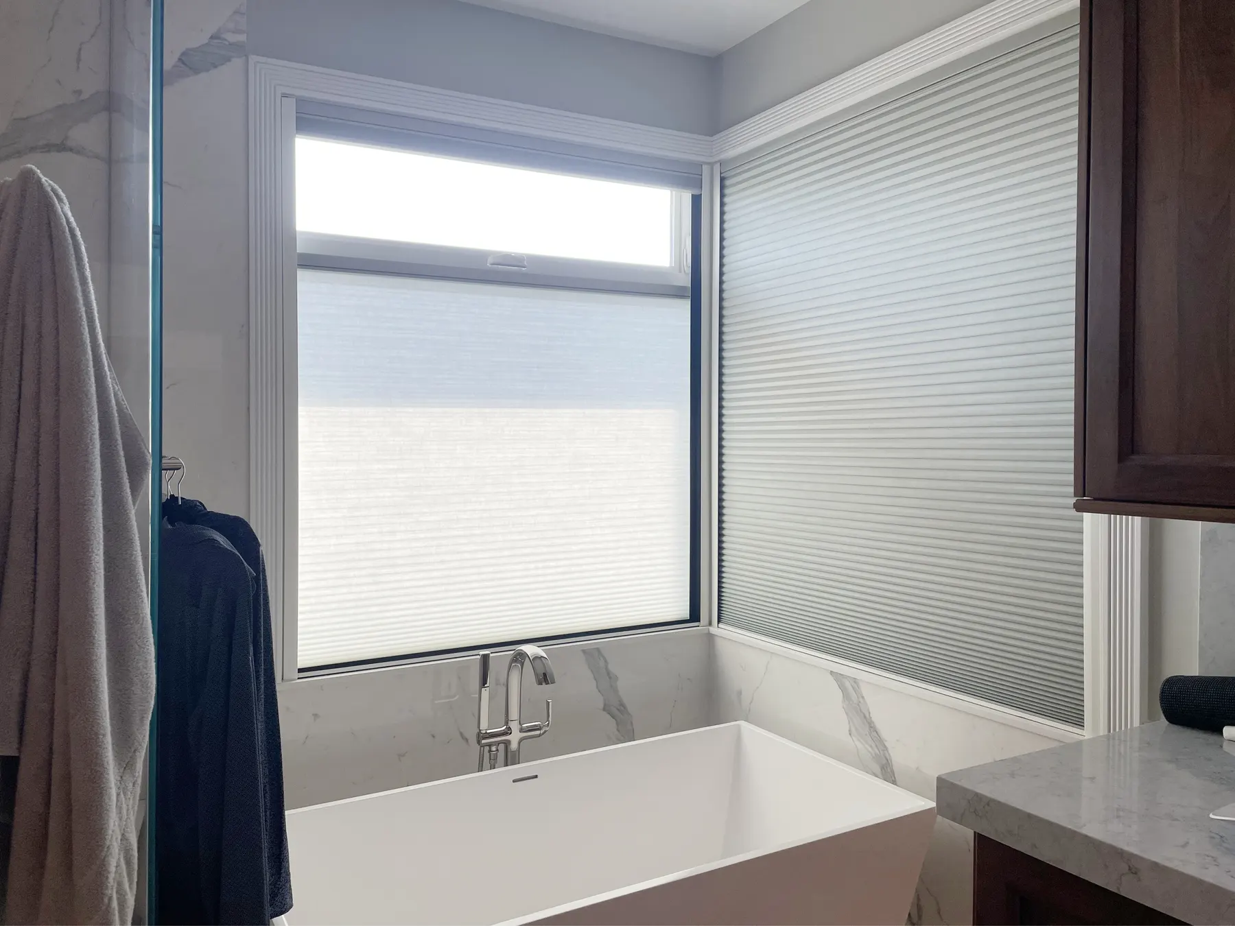 Motorized Honeycomb Shades with Light Filtering and Blackout for a Bathroom in Magnolia, Seattle