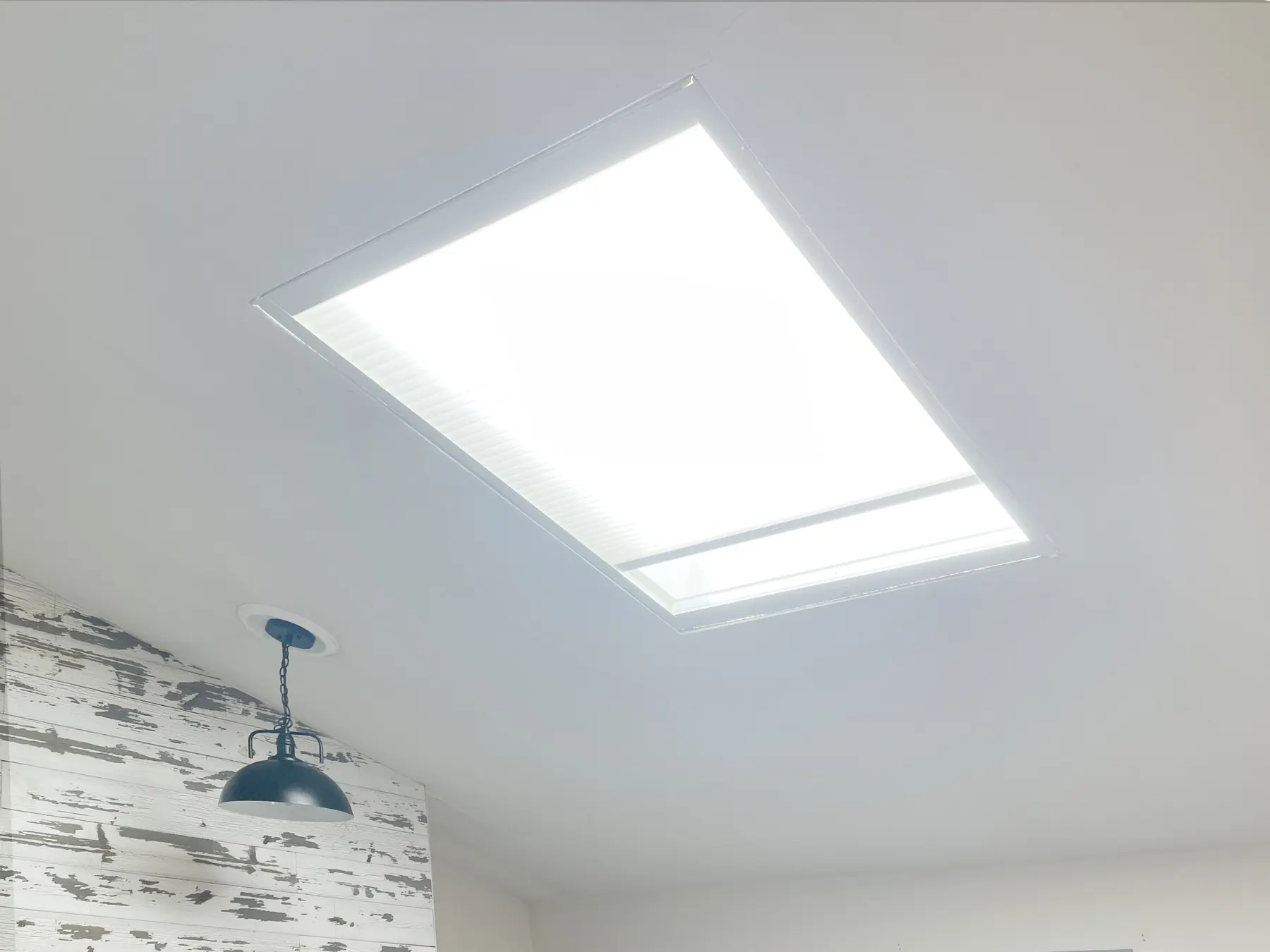 Motorized Honeycomb Shades Replace for a Living Room Skylight in a Kirkland Home