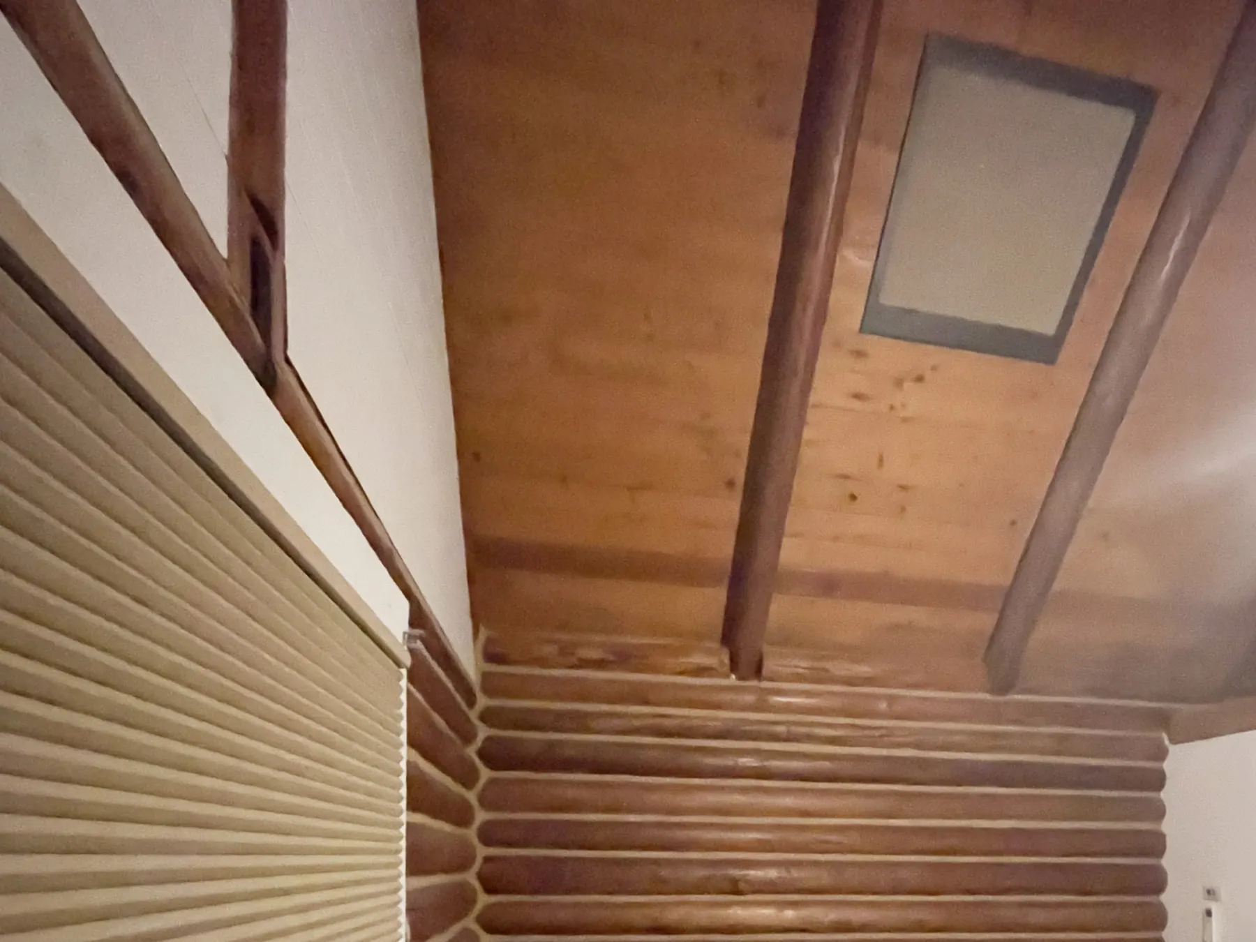Motorized Honeycomb Shades for a Vacation Cabin Bedroom Skylight in Bainbridge Island