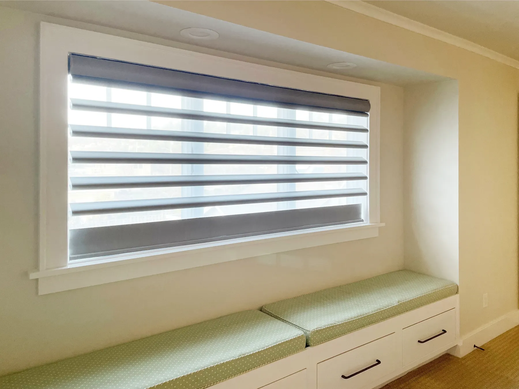 Motorized Room Darkening Pirouette Sheer Shades for a Bedroom in a Shoreline Waterfront Home
