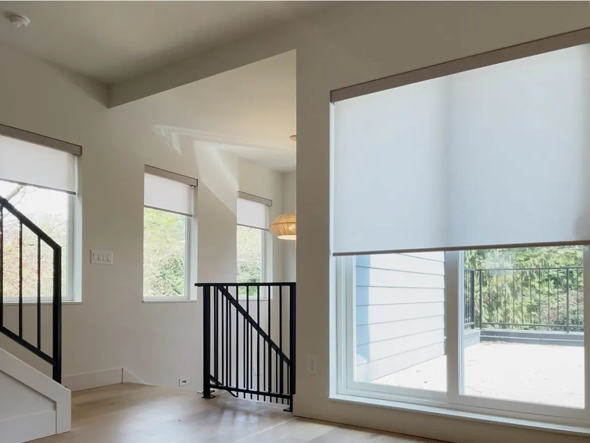 Motorized Roller Shades Partially Raised in a Sliding Door and Windows in Magnolia, Seattle