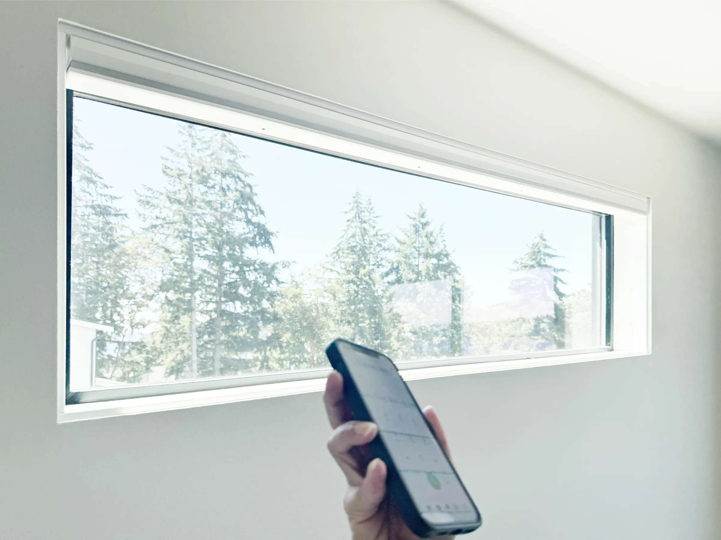 Hand using a smartphone to contact Amazing Blinds by Armi