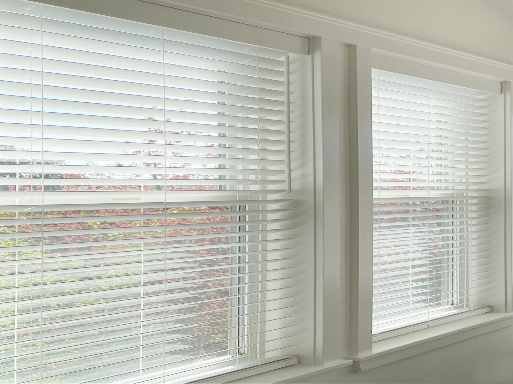 Custom faux wood blinds installed in a Ballard master bedroom