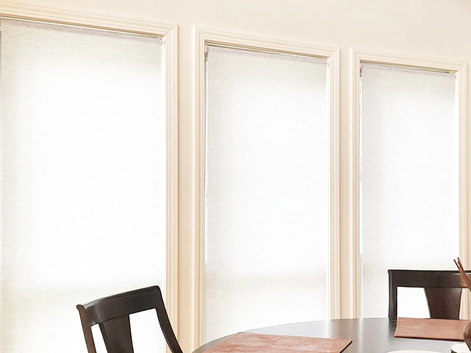 Roller shade installed in a dining room in Bellevue